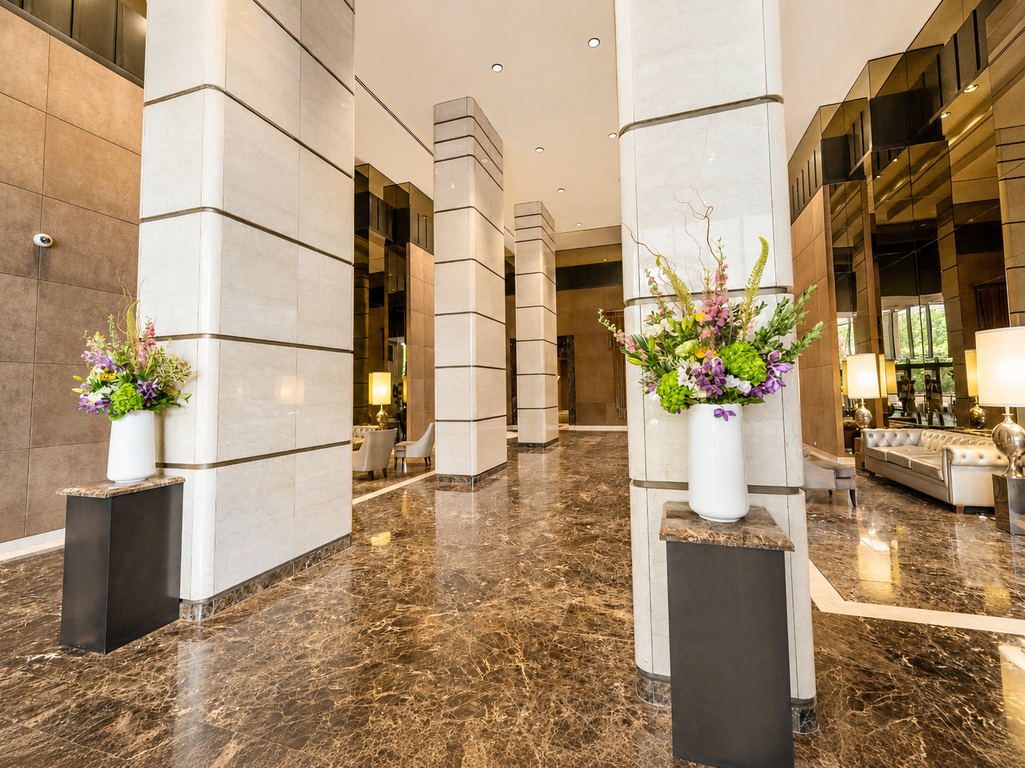 Marble lobby with towering columns at The Corinthian